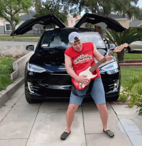 Shredding Guitar In Front Of Tesla GIF