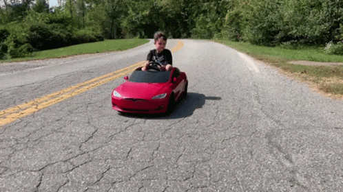 Kid With Toy Tesla Model S GIF