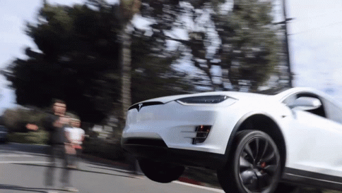 White Tesla Model X Suspension Test GIF
