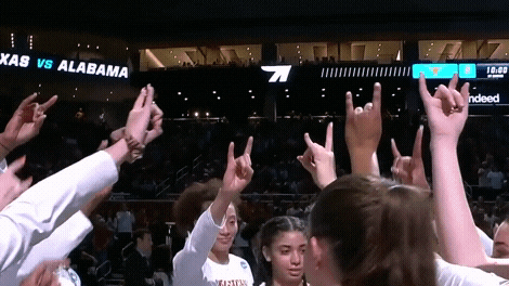 Texas Girls Team Doing Hook Em Sign GIF