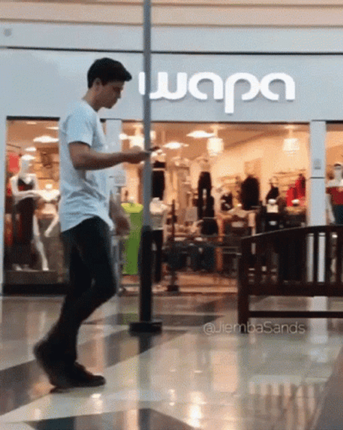 Texting While Walking Mishap GIF