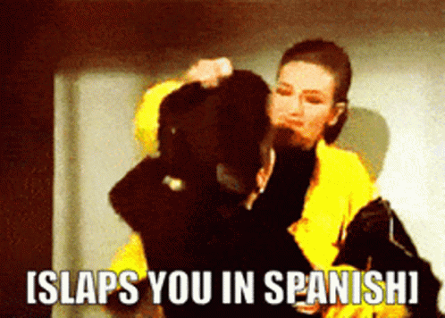 Thalia In Yellow Suit Slaps You In Spanish GIF