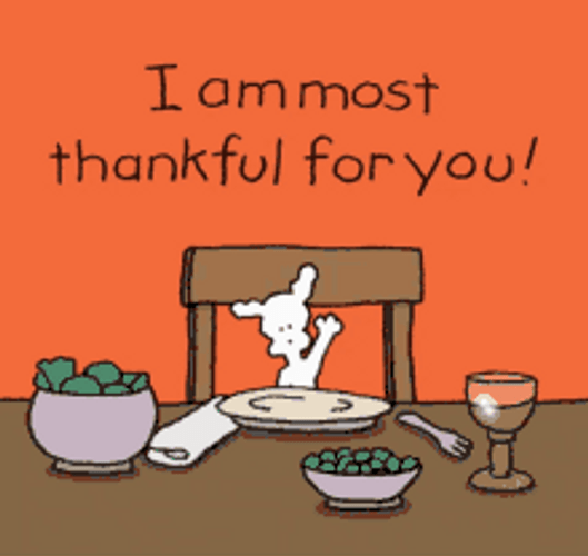 Thanksgiving Dog Waving At Dinner Table GIF