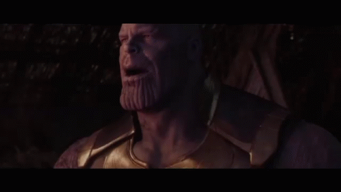 Thanos From Avengers Infinity War Is Smoking A Cigarette In A Dark Room . GIF