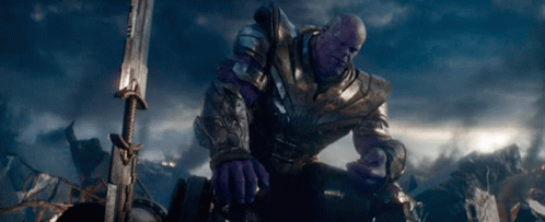 Thanos Is Kneeling Down With A Sword In Front Of Him GIF