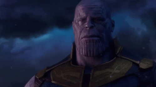 Thanos Says " I 'M Sorry Little One " In Front Of A Dark Sky GIF