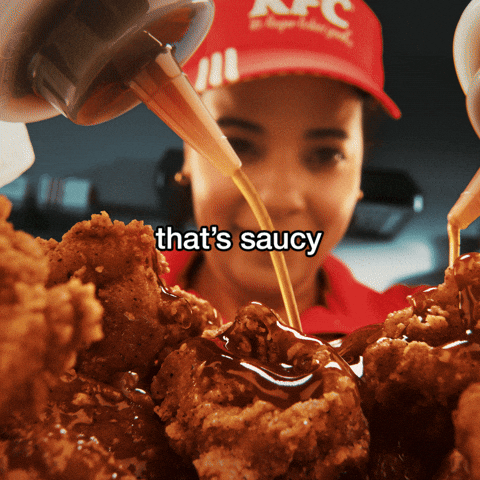 Thats Saucy Woman Coating Chicken With Sauce GIF