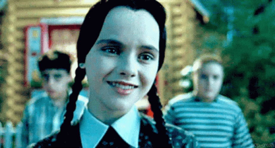 The Addams Family Wednesday Creepy Smile GIF | GIFDB.com