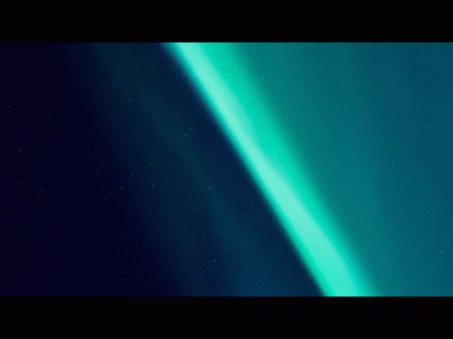 The Aurora Borealis Is Visible In The Night Sky Above The Northern Lights GIF
