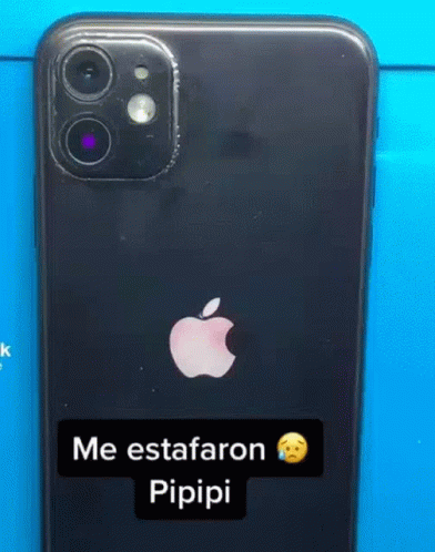 The Back Of A Black Apple Iphone With A Sticker On It That Says Me Estaaron Pipipi . GIF