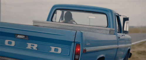 The Back Of A Blue Ford Truck Is Shown GIF