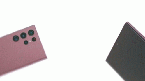 The Back Of A Cell Phone With A Pen On It GIF