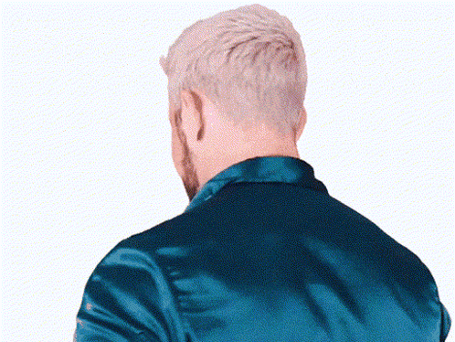 The Back Of A Man 'S Head With A Blue Jacket GIF