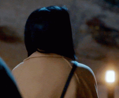 The Back Of A Woman 'S Head Is Shown In A Close Up GIF