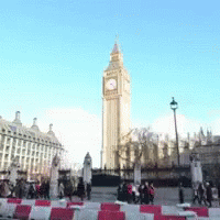 The Big Ben Clock Tower In London Is Surrounded By People GIF