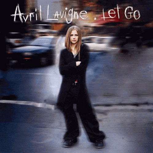 The Cover Of Avril Lavigne 'S Let Go Album Features A Woman Standing On A Street GIF