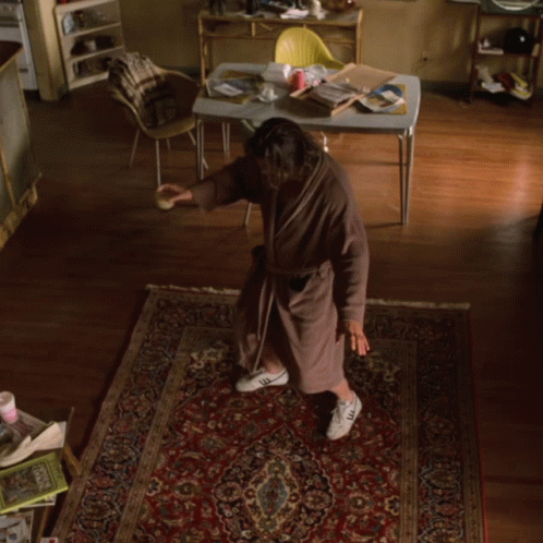 The Dude Doing Poses On His Robe GIF