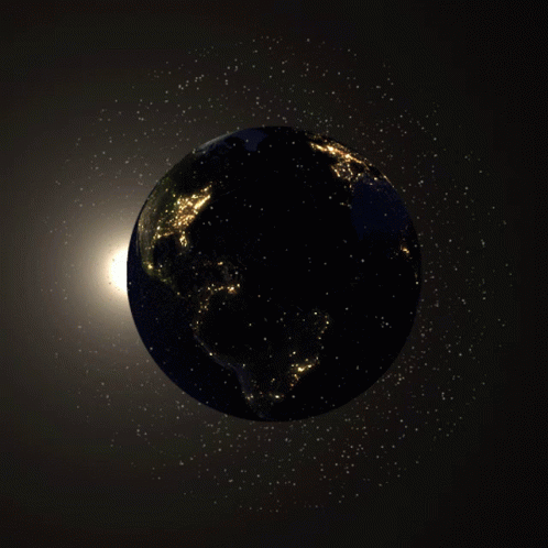 The Earth Is Lit Up At Night And The Sun Is Shining Brightly Behind It GIF