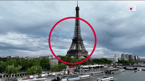 The Eiffel Tower Is Surrounded By A Red Circle With The Number 2 On The Bottom Right GIF