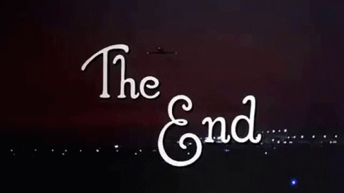 The End Is Written In White Letters On A Black Background With Fireworks Exploding In The Background . GIF