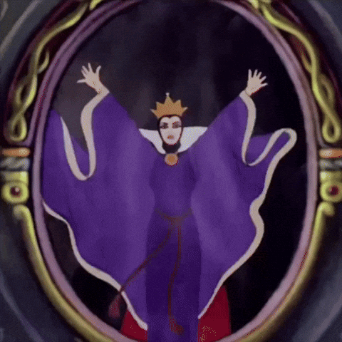The Evil Queen From Snow White And The Seven Dwarfs Is Shown In A Mirror GIF