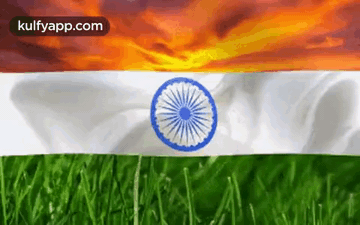 The Flag Of India Is Waving In The Wind With A Sunset In The Background GIF