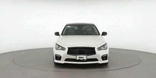 The Front Of A White Car With A License Plate That Says Shift GIF