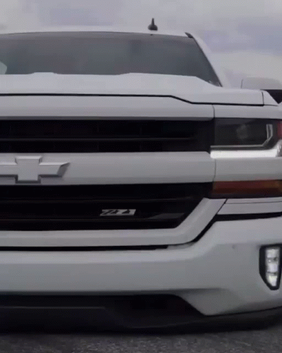 The Front Of A White Chevrolet Truck With The Letters Ztx On The Grille GIF