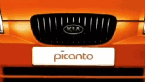 The Front Of An Orange Kia Picanto With A Black Grill GIF