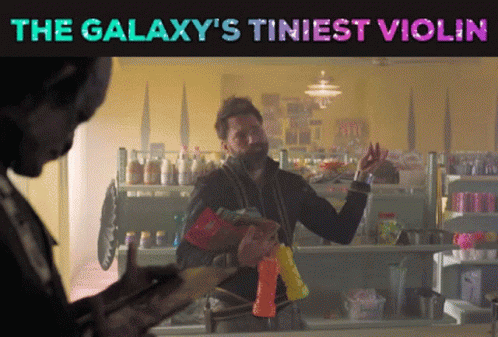 The Galaxy 'S Tiniest Violin Is Displayed On A Poster GIF