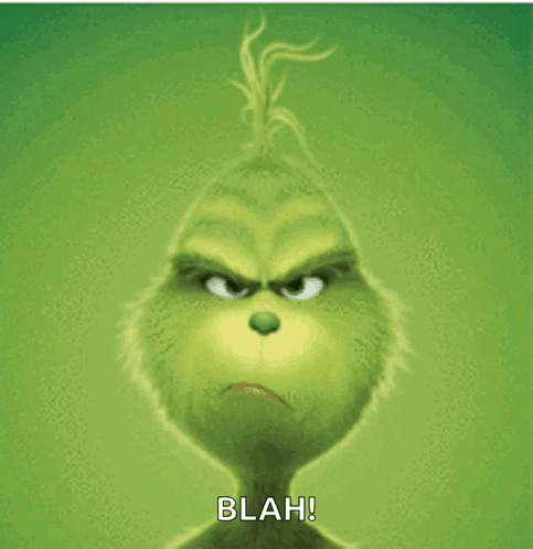 The Grinch From The Movie The Grinch Has A Very Angry Look On His Face And Says Blah GIF