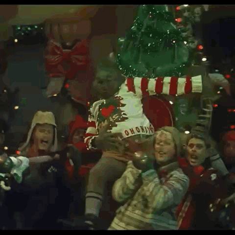 The Grinch Is Wearing A Sweater That Says Ho Ho Ho GIF