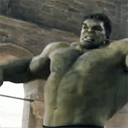 The Hulk Is Holding A Sword In His Hand And Looking At The Camera . GIF