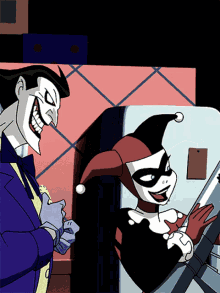 The Joker And Harley Quinn Are Standing Next To Each Other And Smiling GIF