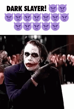The Joker Is Holding A Knife In Front Of A Crowd And Says Dark Slayer ! GIF