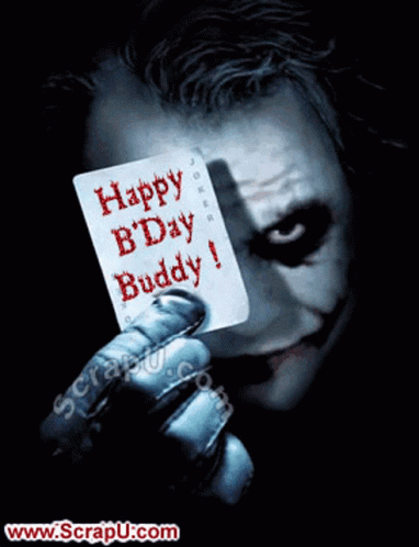 The Joker Is Holding Up A Card That Says Happy Bday Buddy GIF