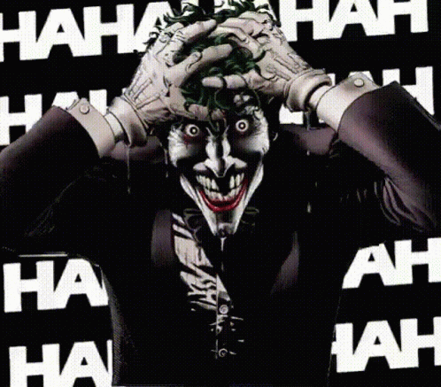 The Joker Is Laughing While Holding His Hands To His Face GIF