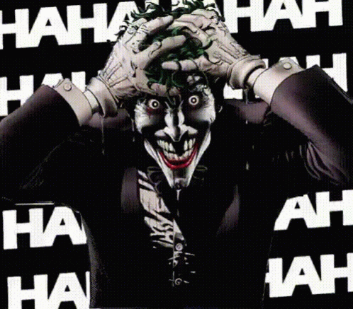 The Joker Is Making A Funny Face With His Hands On His Face GIF