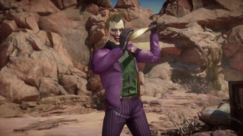 The Joker Is Wearing A Purple Suit And Holding A Sword In His Hand . GIF