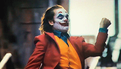 Joker In Red Suit And Yellow Vest Dancing GIF