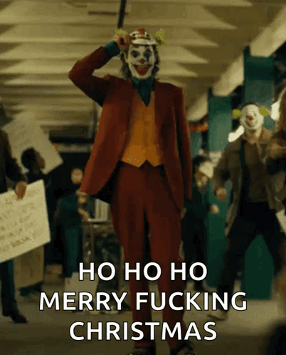 The Joker Says Merry Fucking Christmas In Front Of A Crowd Of Protesters GIF