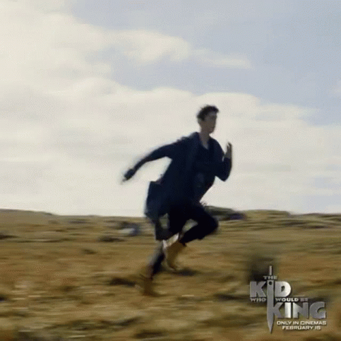 The Kid Who Would Be King Poster Man Running in Field