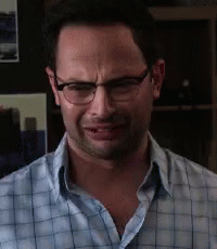 The Man Is Wearing Glasses And A Plaid Shirt GIF