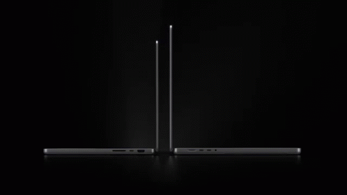 The New Macbook Pro Is Being Advertised On A Black Background GIF