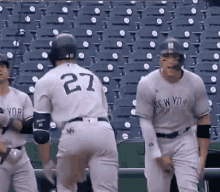 The Number 27 Is On The Back Of A Baseball Player 'S Jersey GIF