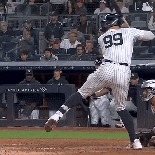 The Number 99 Is On The Back Of A Baseball Player GIF