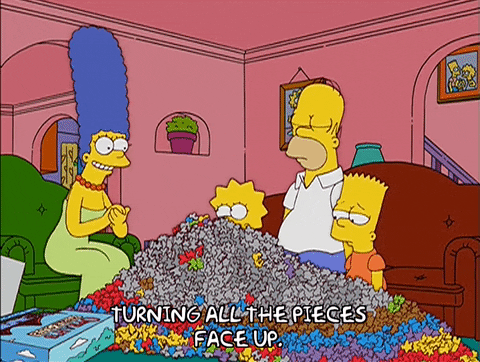 The Simpsons With Mountain Of Jigsaw Puzzle Pieces GIF