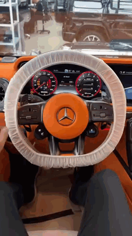 The Steering Wheel Of A Mercedes Is Covered With Plastic GIF