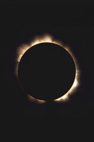 The Sun Is Partially Obscured By The Moon During A Partial Solar Eclipse GIF