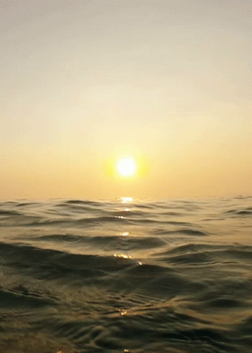 Sunset Over Ocean Waves Breaking GIF